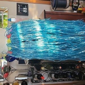 Hula Grass skirt. Plastic,elastic waist. Med.